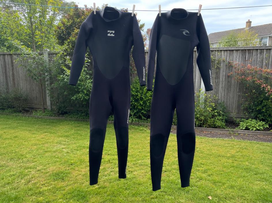 Pair of adult wetsuits